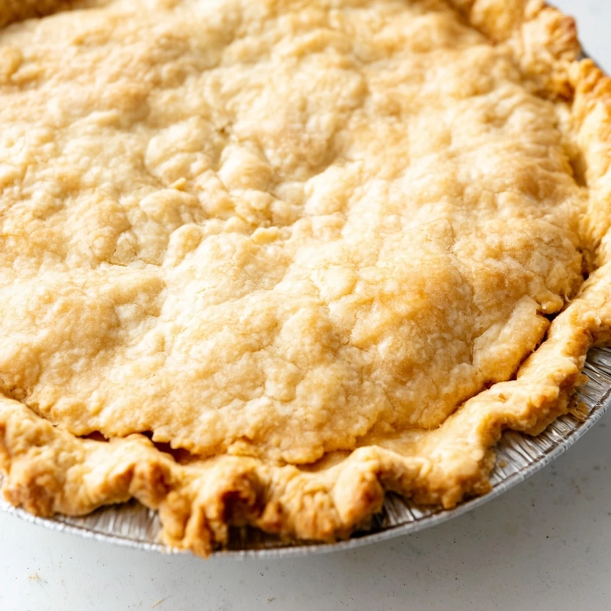 This homemade Savory Pie Crust shows a perfectly crimped edge, prepared for flavorful fillings.