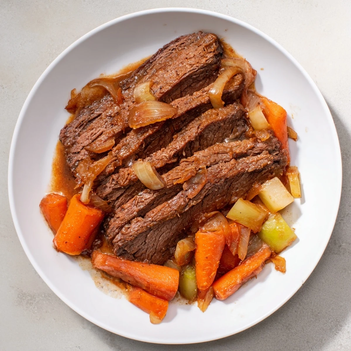 Fork-tender beef brisket, braised to perfection with savory vegetables, ideal for a Sunday dinner.