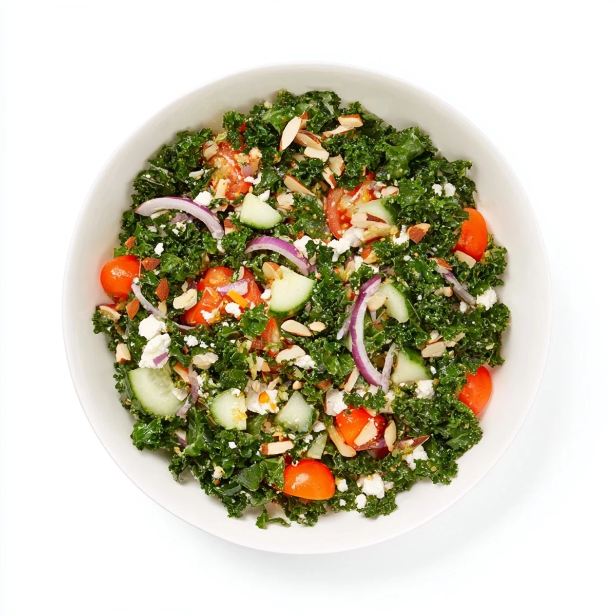 Fresh kale salad piled high, with toasted almonds and feta, a perfect side dish.