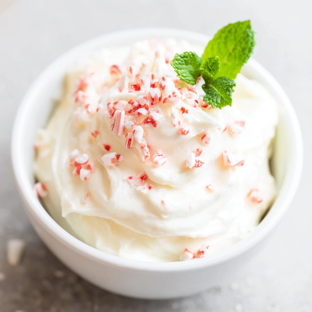 Cream Peppermint, a chilled dessert, creamy white with optional crushed peppermint candy garnish.