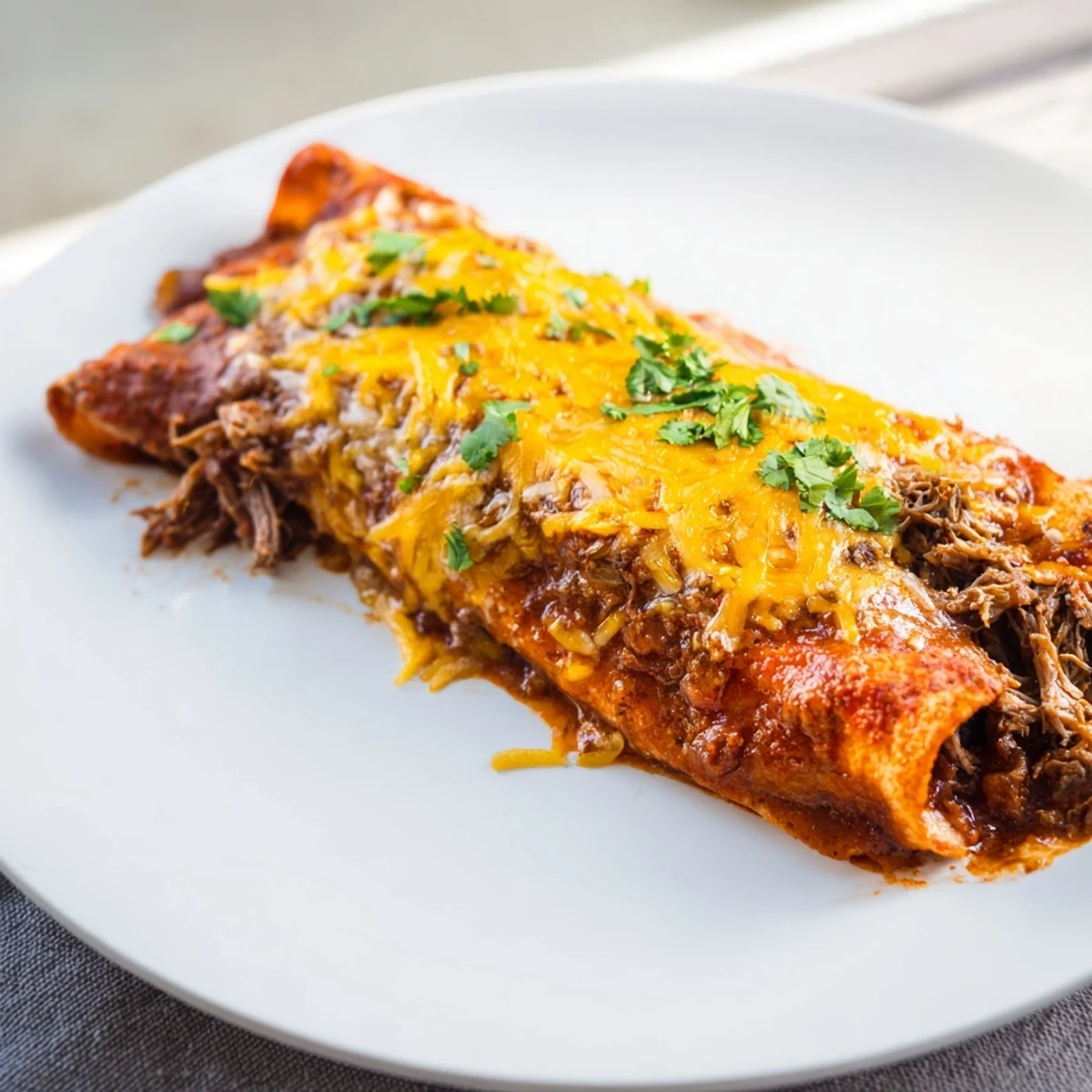 Homemade Beef Enchiladas, a Tex-Mex classic with a rich sauce and a satisfying, cheesy bake.