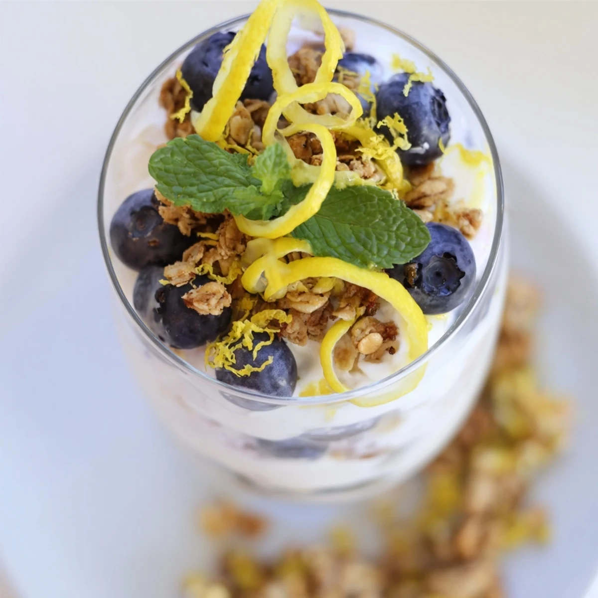 Sweet blueberries and tangy lemon yogurt are layered in this easy Lemon Blueberry Yogurt Parfait, ready to eat.