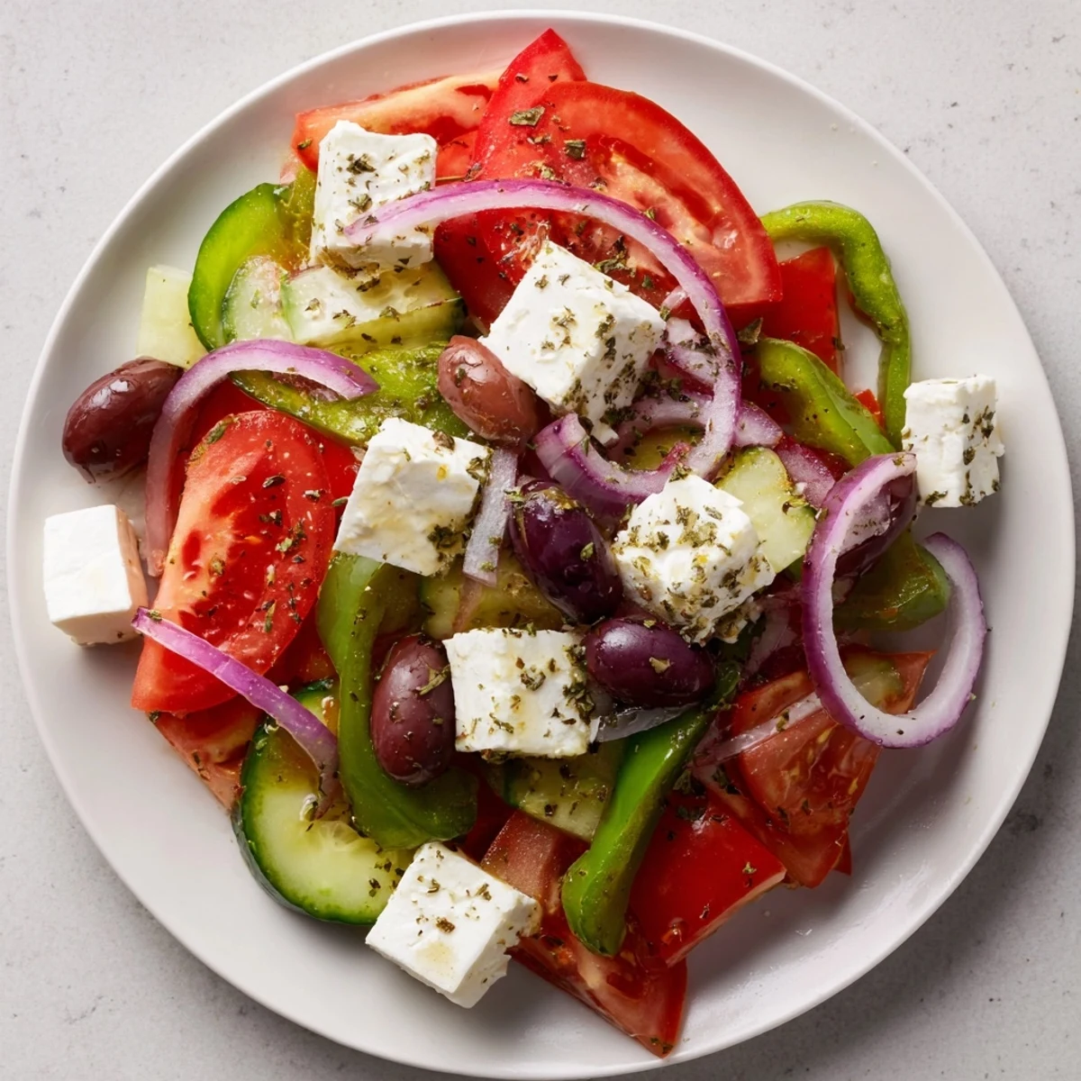 Close-up of a refreshing Greek Salad, with vibrant tomatoes and olives, ready to eat.