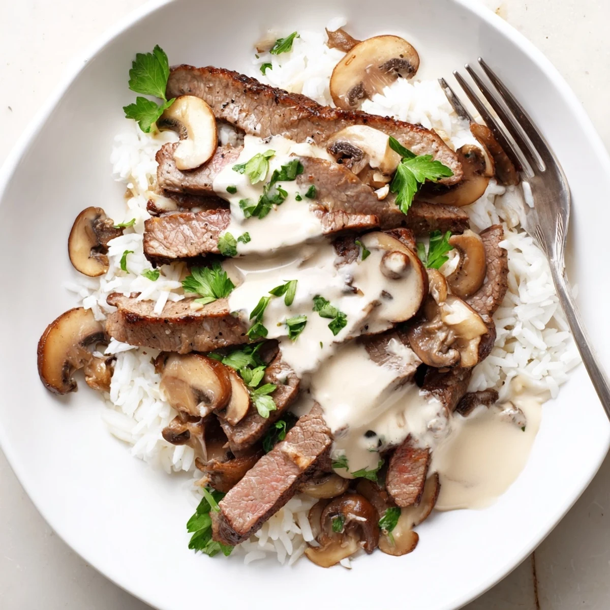 Sizzling skillet of Beef Stroganoff with Basmati Rice, ready to serve for a cozy meal.