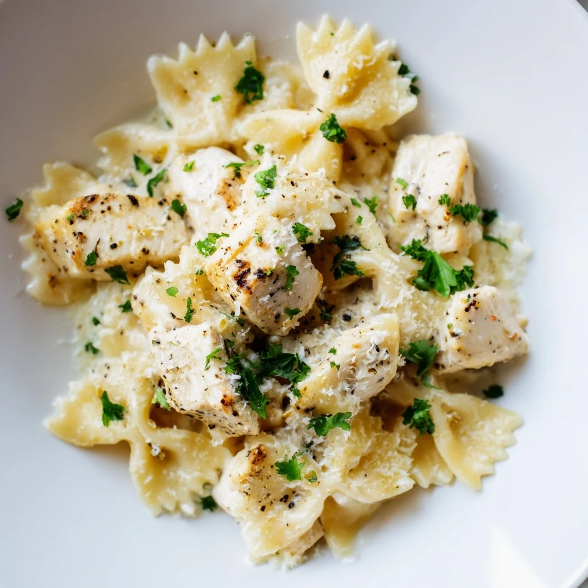 Golden, pan-seared chicken pieces and bowtie pasta coated in a glossy garlic butter and mozzarella sauce.