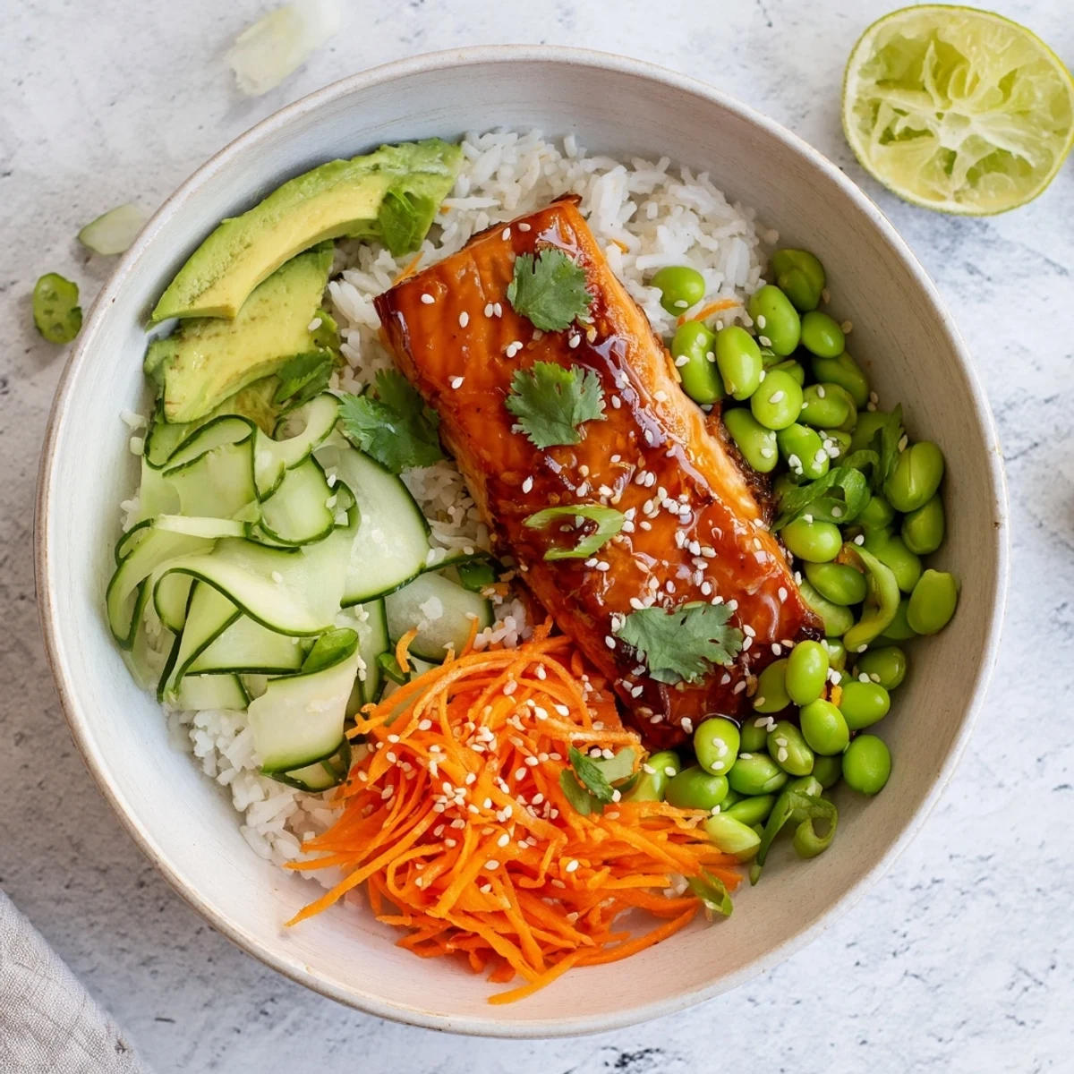 Golden honey glazed salmon bowl with colorful vegetables and fluffy rice