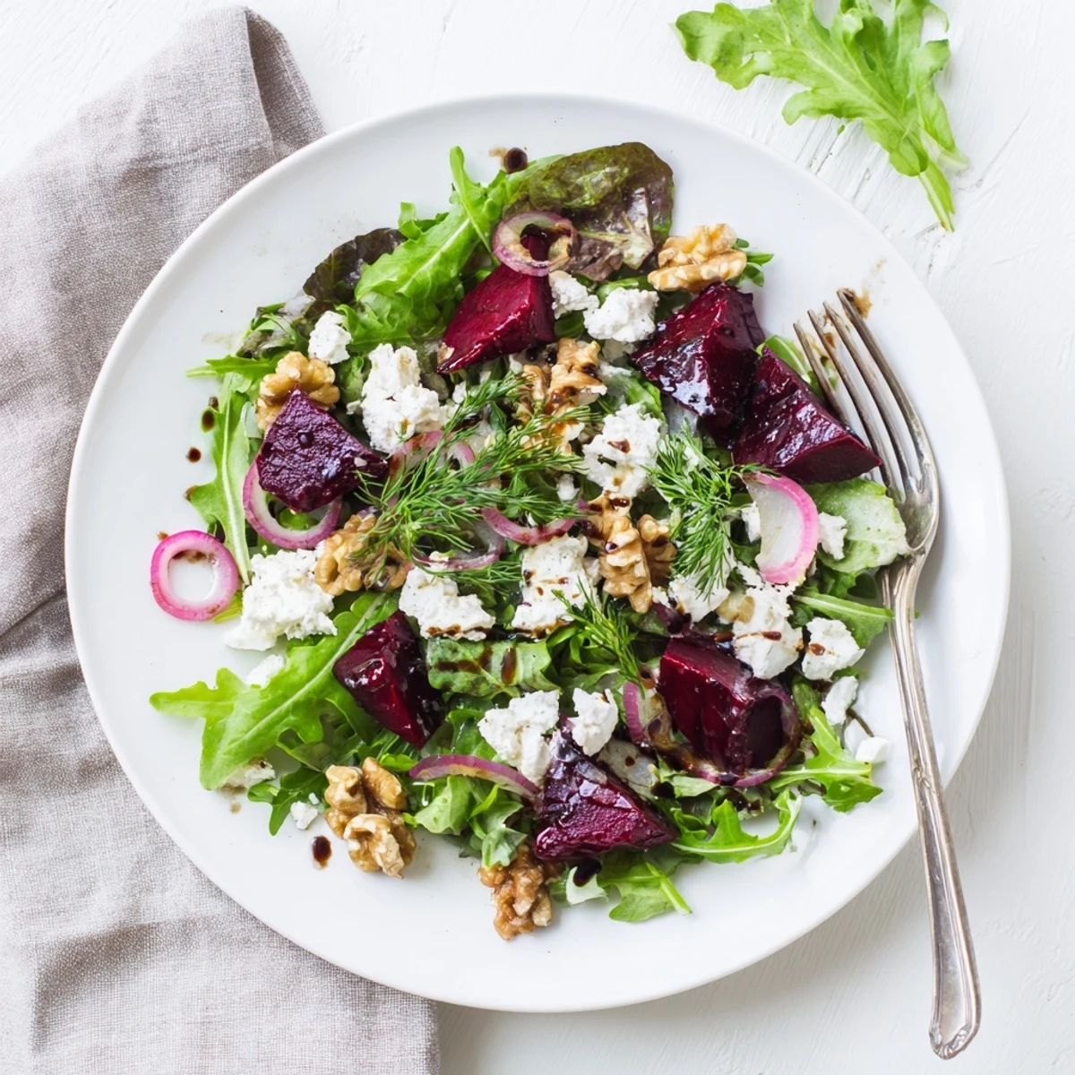 Fresh ultimate beet salad bowl with glistening roasted beets, peppery arugula, tangy goat cheese crumbles, and golden toasted nuts