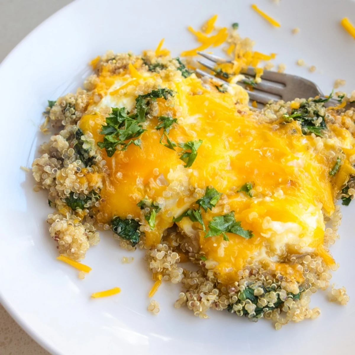 Protein-packed vegetarian quinoa spinach and egg bake fresh from the oven with garnish
