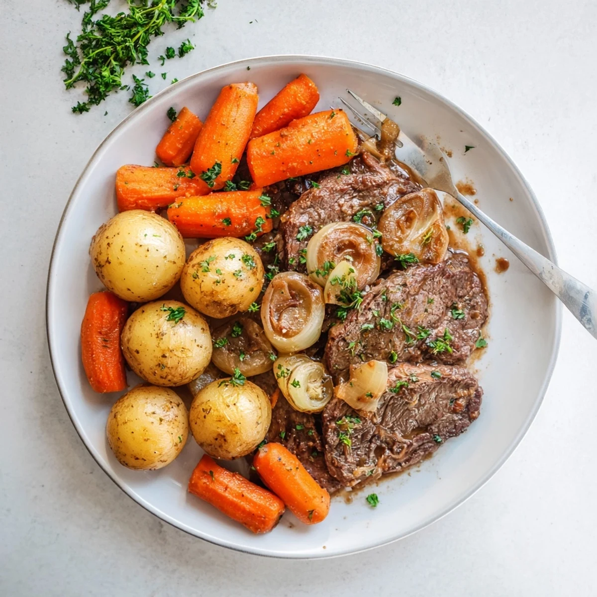 Hearty slow cooker steak and potatoes with tender beef, carrots, and onions in a savory beef broth