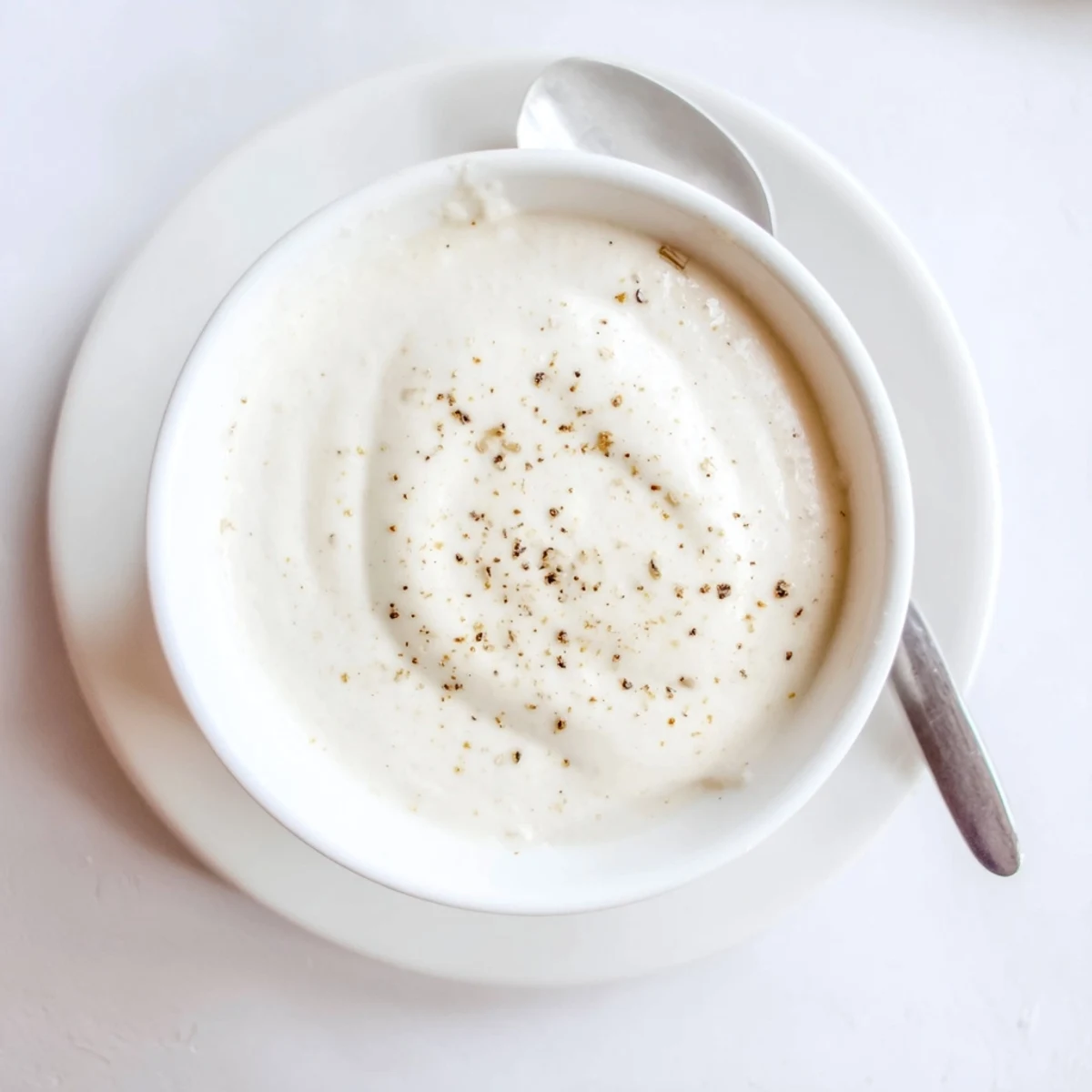 Creamy white chicken shawarma garlic sauce drizzled generously over seasoned sliced chicken meat