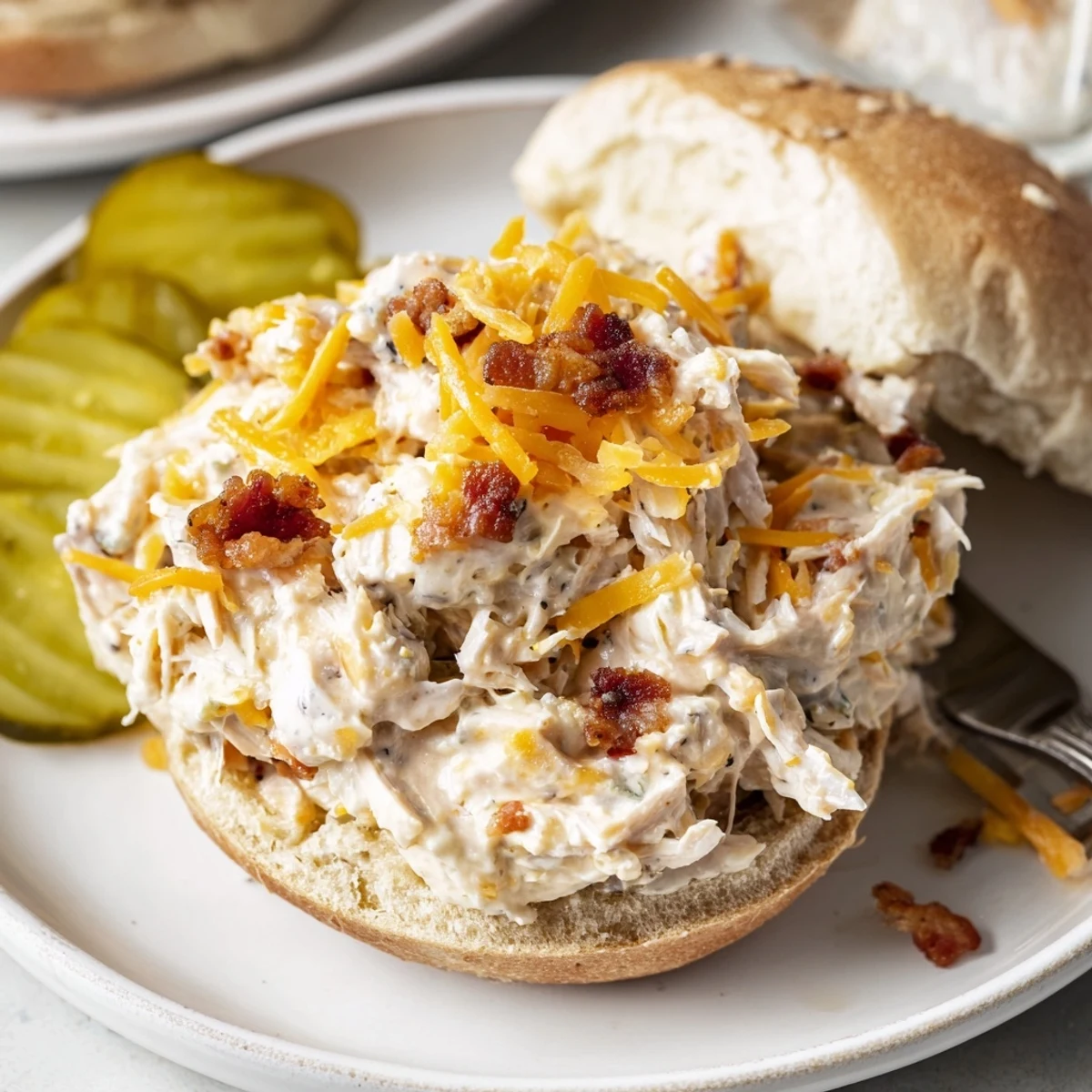 Warm Crack Chicken Sandwiches mounded on brioche buns, tangy ranch and pickles