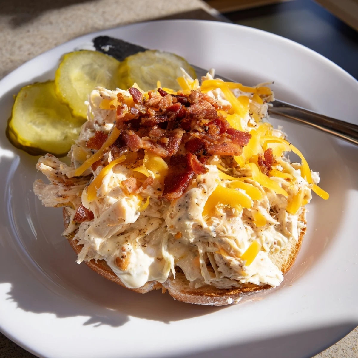 Baked Crack Chicken Sandwiches oozing cheddar, smoky bacon crumbs, served with iced tea