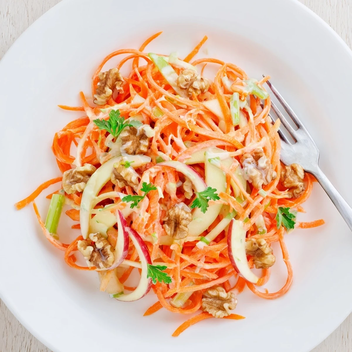 Bright, zesty dressing coats Crunchy Apple Carrot Salad With Creamy Citrus Dressing