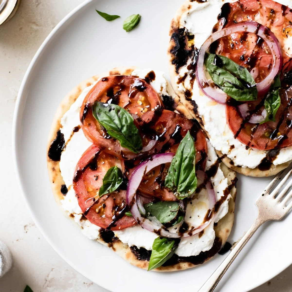 Caprese Pita Pizza With Whipped Garlic Feta on warm oven-crisped pita
