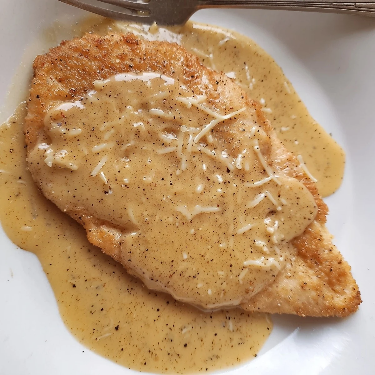 Chicken With Cheese Sauce spooned over golden seared breasts, steaming and rich.