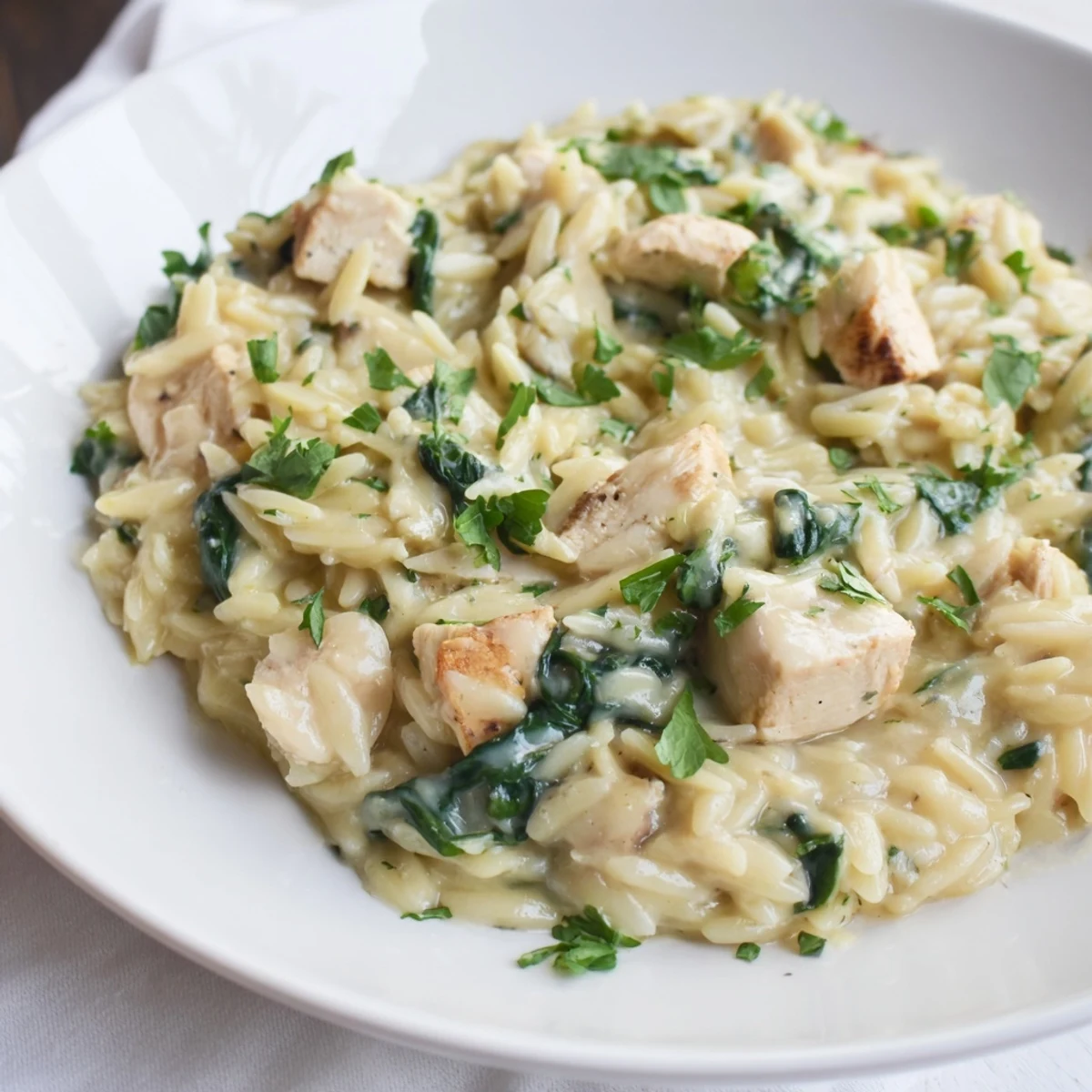Tender chicken and orzo simmered in rich garlic butter sauce with spicy Pepper Jack cheese