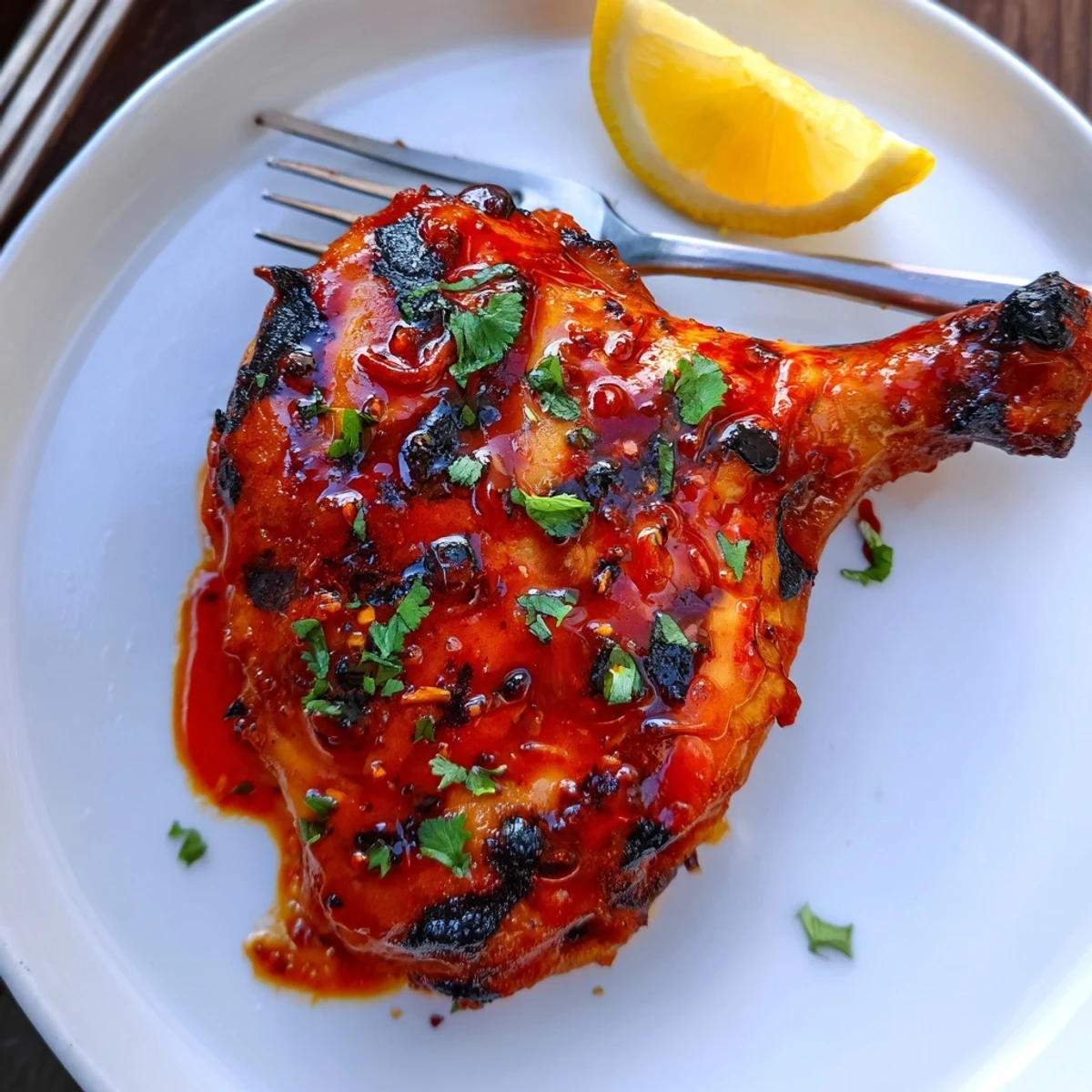 Juicy Peri Peri Chicken resting on platter, smoky aroma, cilantro garnish