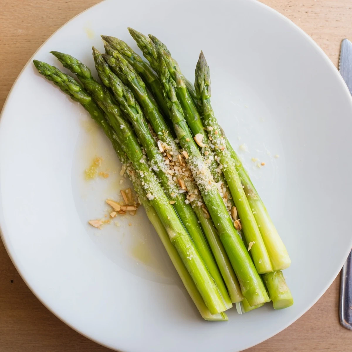 Bright green spears of Steamed Asparagus, fork-tender and lightly salted, ready to serve.