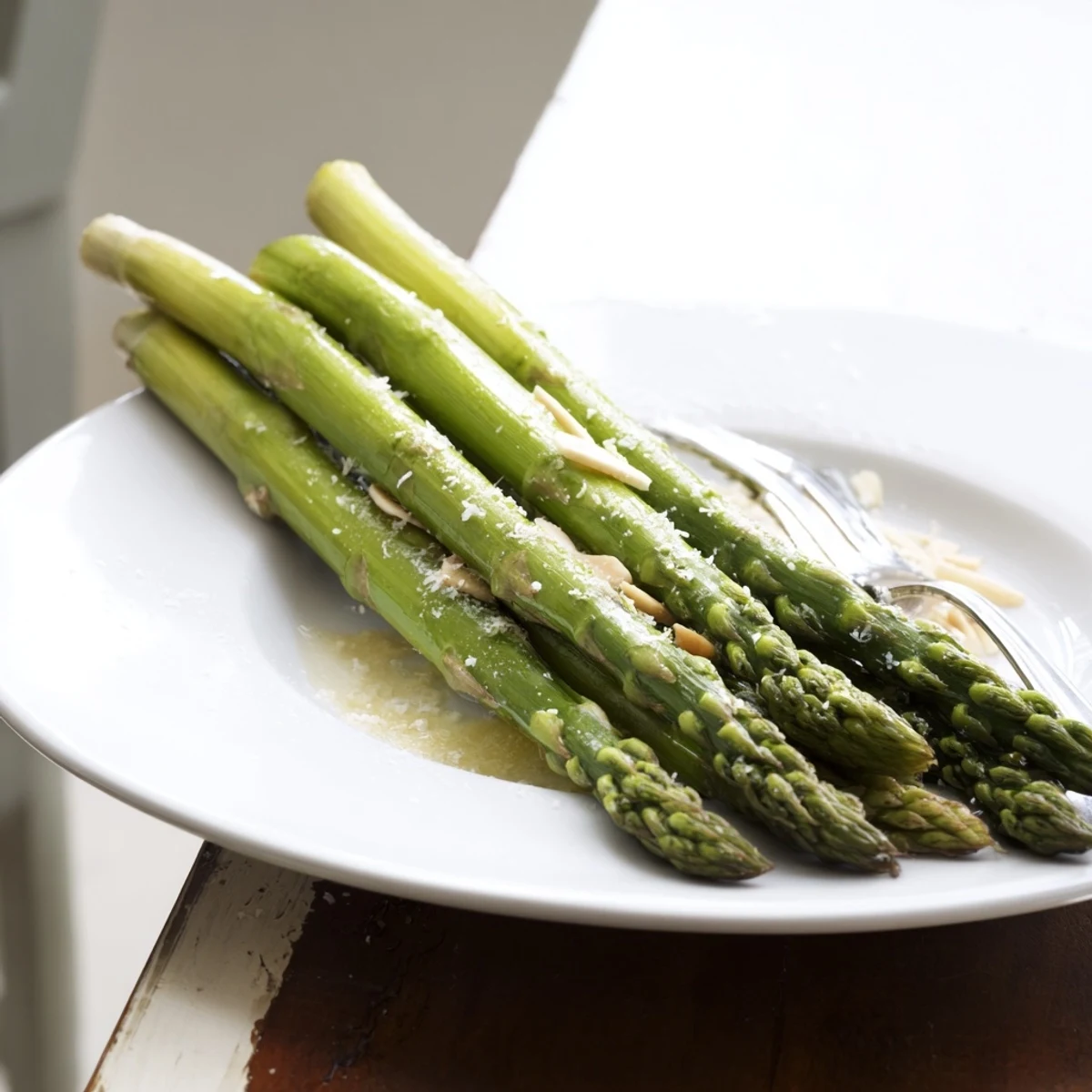 Steamed Asparagus in steamer basket, crisp-tender texture, suggested pairing grilled fish.