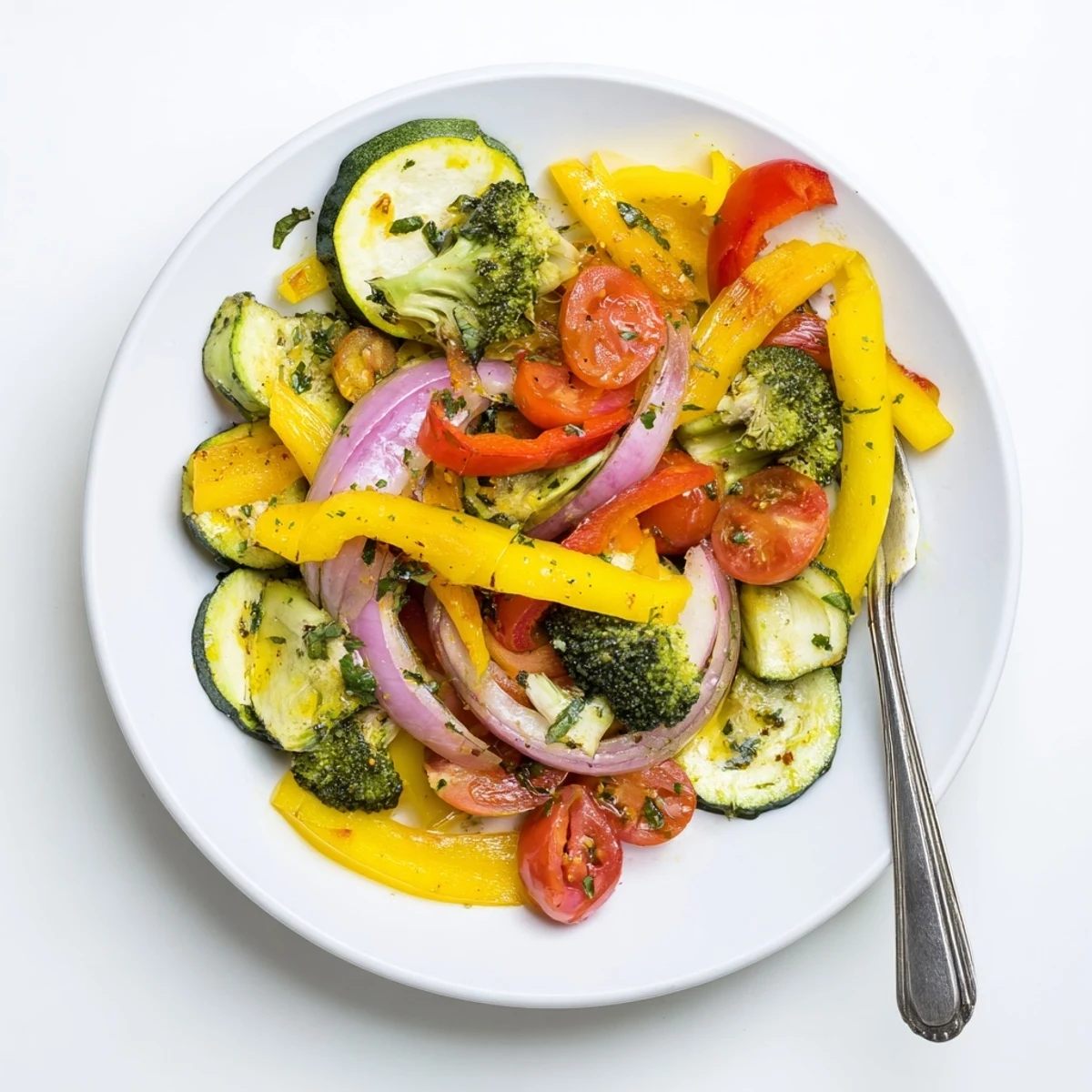 Serve Garlic Infused Olive Oil Sauteed Veggies alongside grilled chicken for vibrant contrast.  