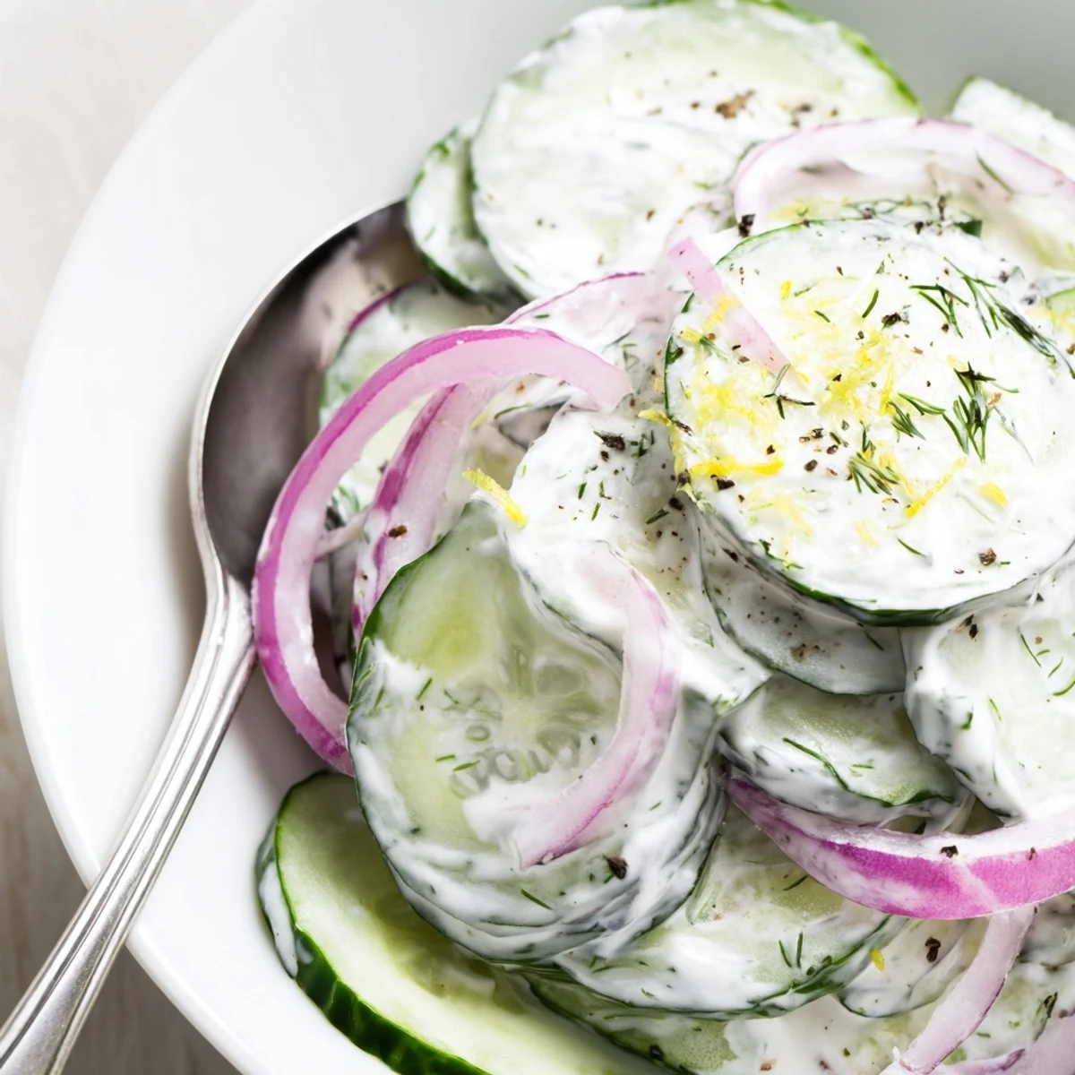 Chilled Tzatziki Cucumber Salad tossed with dill and lemon, bright summer side