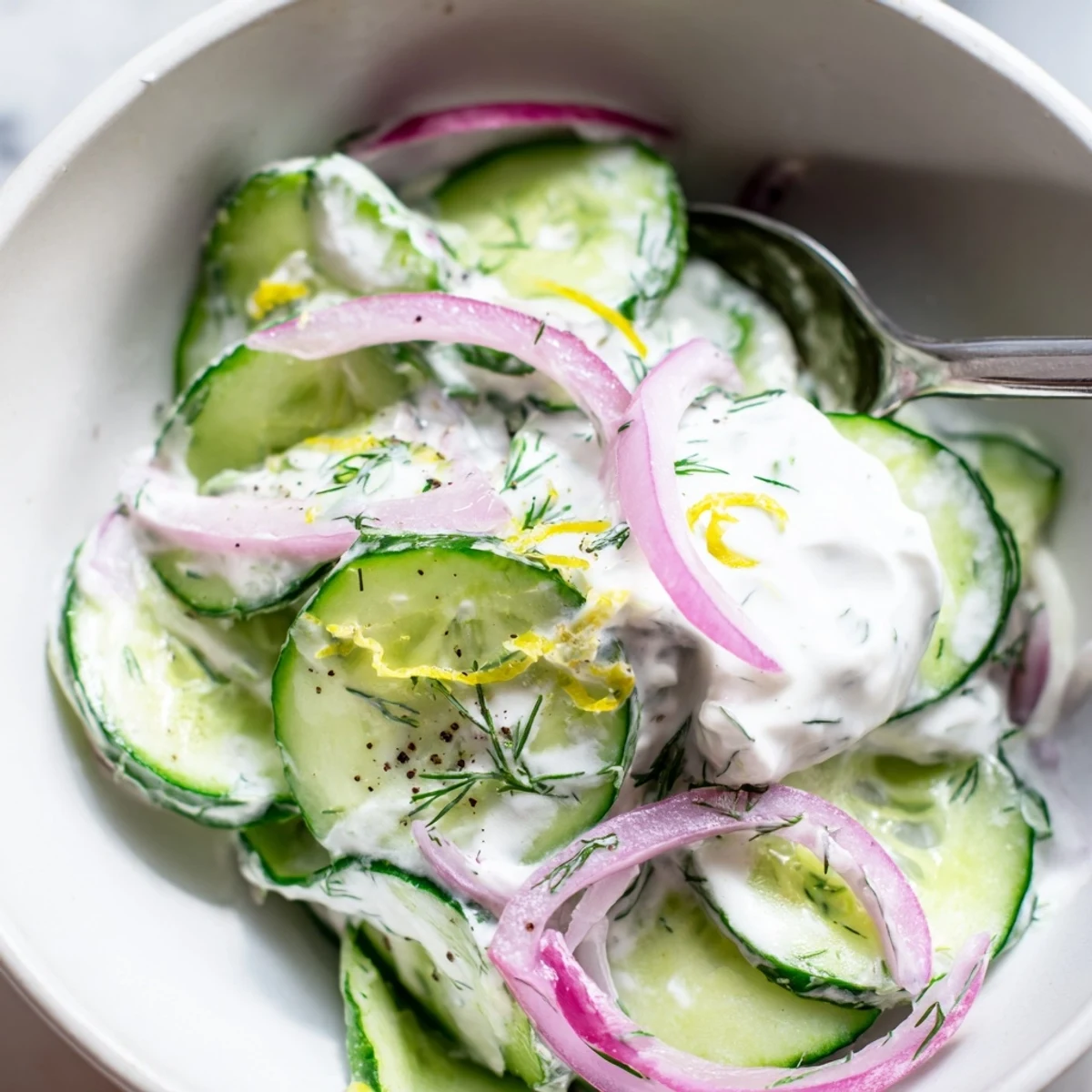 Tzatziki Cucumber Salad served alongside warm pita, tangy yogurt and crunchy slices