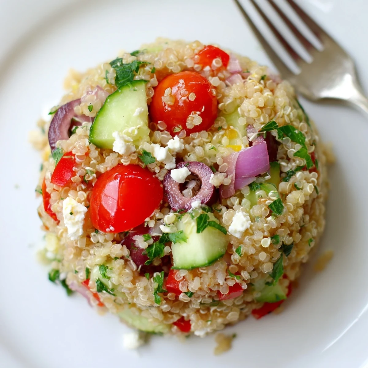 Tossed Greek Quinoa Salad Recipe chilled, lemony dressing coating colorful vegetables