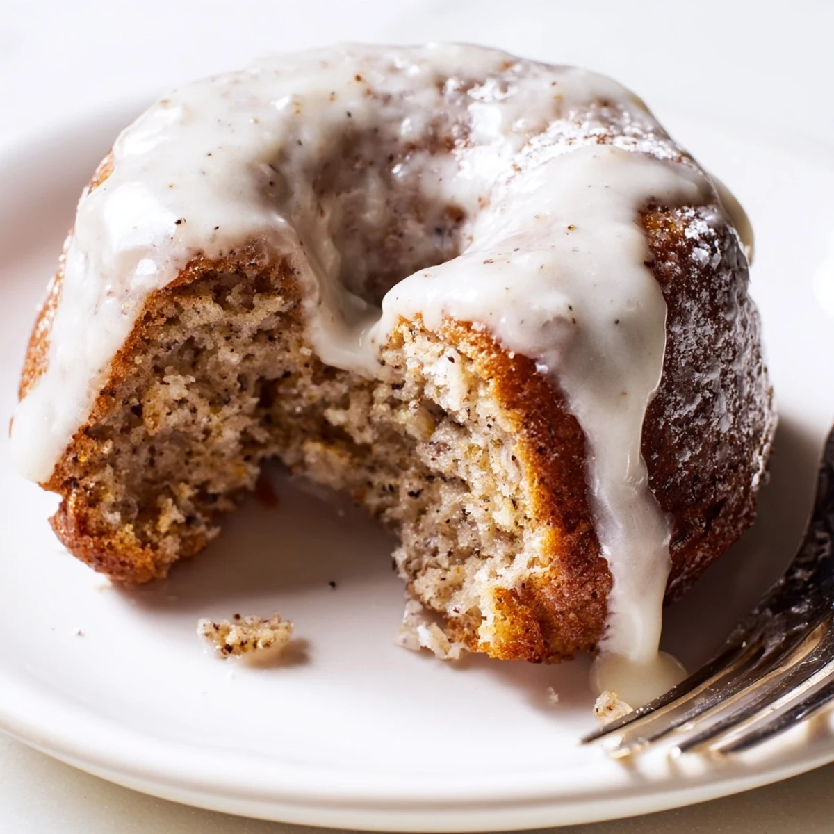 Cake-like banana bread donuts sprinkled with cinnamon sugar arranged for breakfast serving