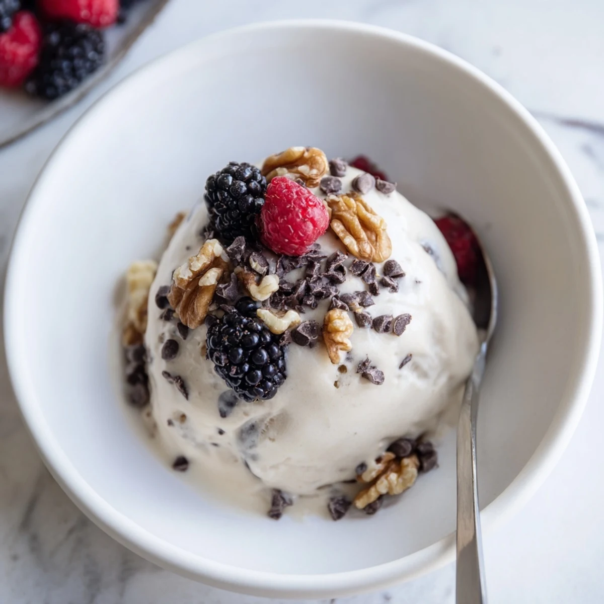 Dairy-free banana nice cream with swirl texture and coconut flakes on top