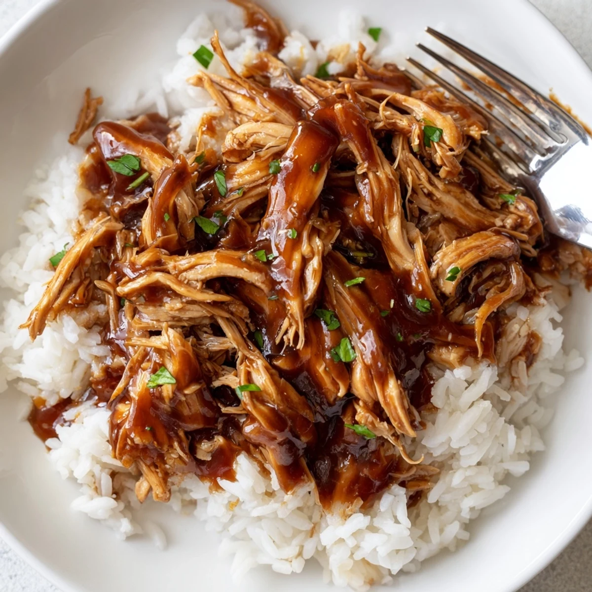 Slow-cooked Crockpot Honey Garlic Chicken, tender and fragrant with ginger, served atop steamed vegetables