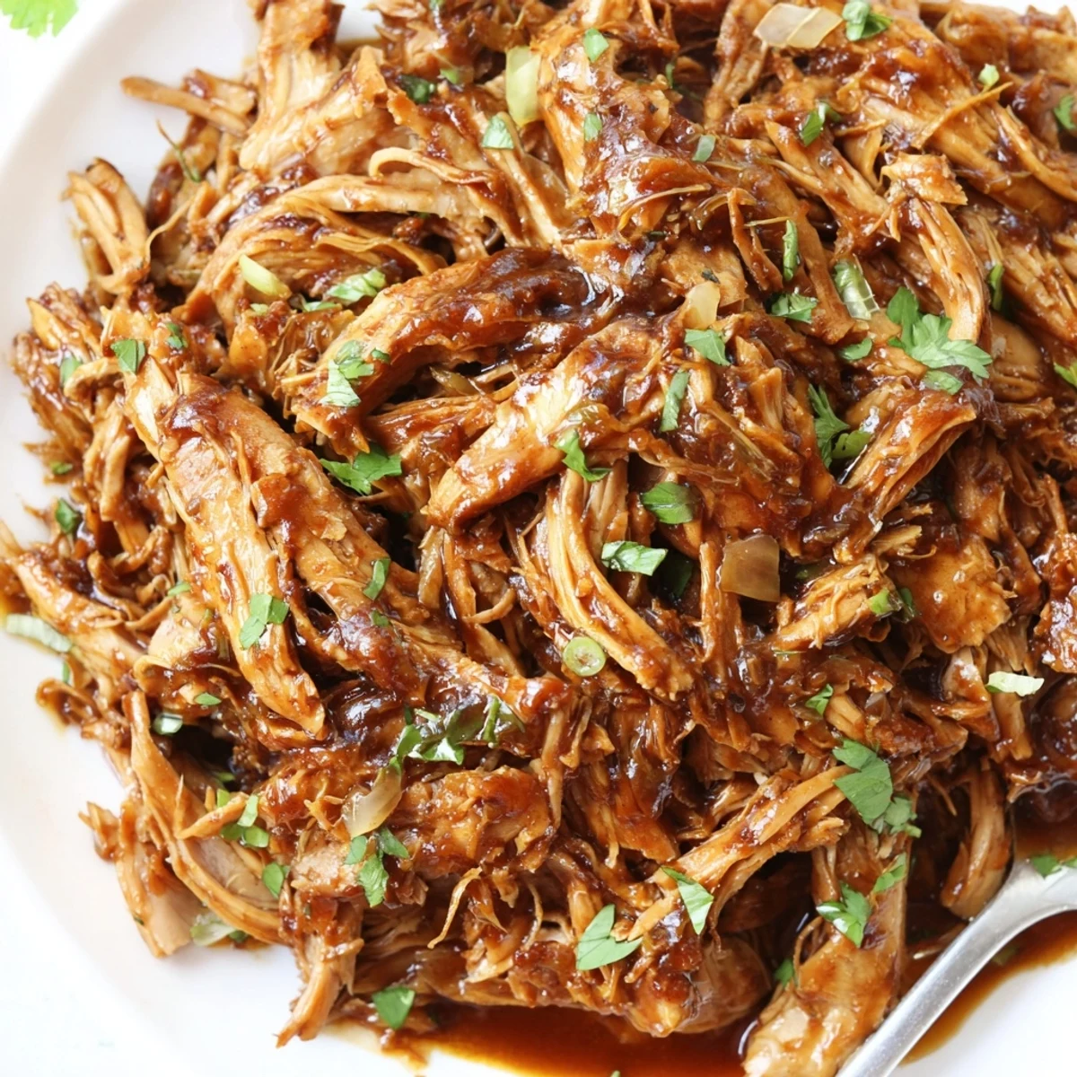 Slow Cooker Brown Sugar Garlic Chicken glazed in sticky brown sugar sauce, steam rising