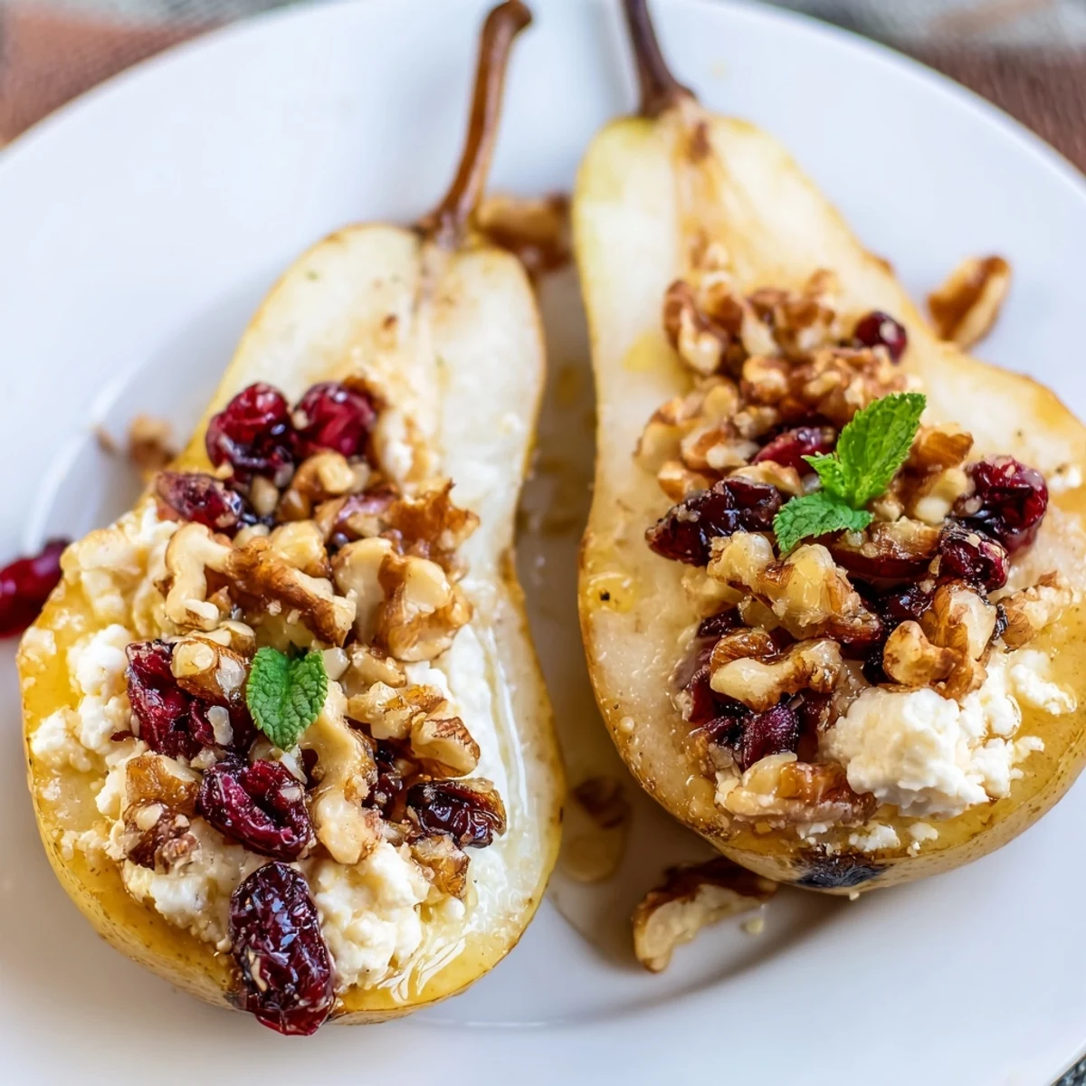 Golden Baked Pears With Feta Honey Cranberries resting in a parchment-lined dish.