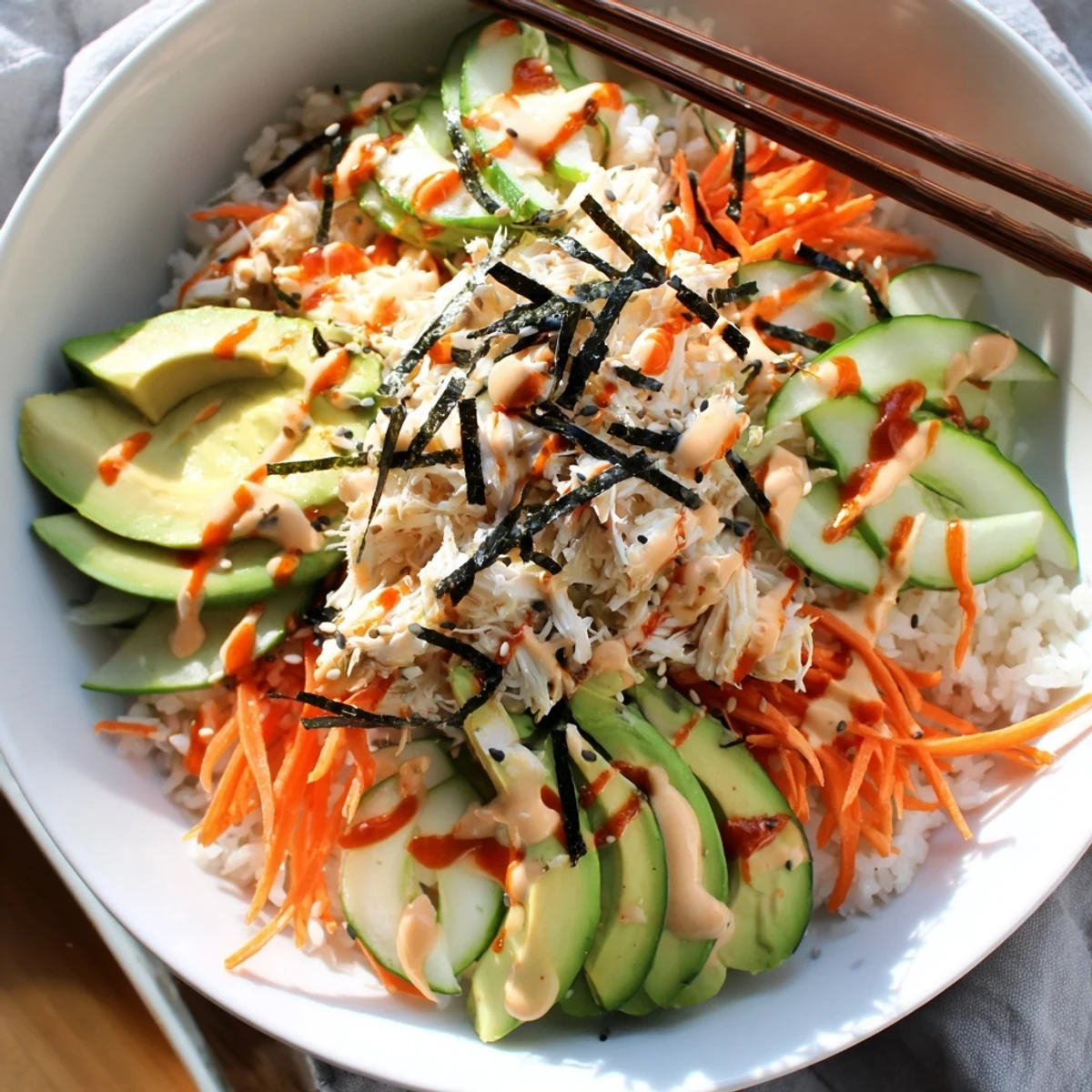 California Roll Sushi Bowls with creamy avocado, shredded crab, and sesame crunch.
