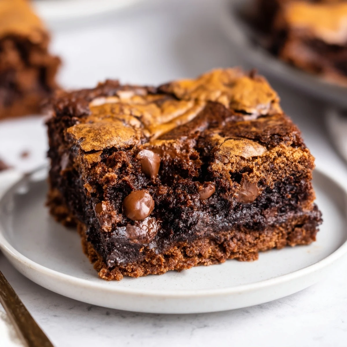 Warm Fudgy Chewy Brookies Recipe served with a scoop of vanilla ice cream
