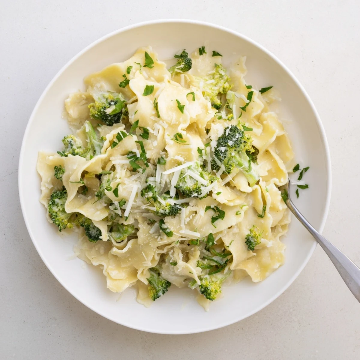 Creamy Mafaldine Pasta Limone Broccoli tossed in a bright lemon parmesan sauce with tender green florets