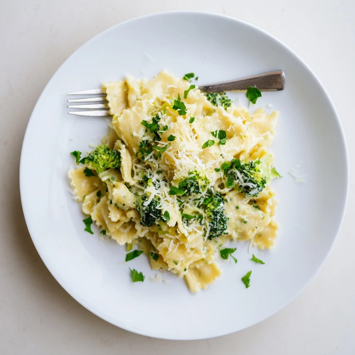 Elegant ribbons of Mafaldine Pasta Limone Broccoli garnished with fresh basil and golden lemon zest