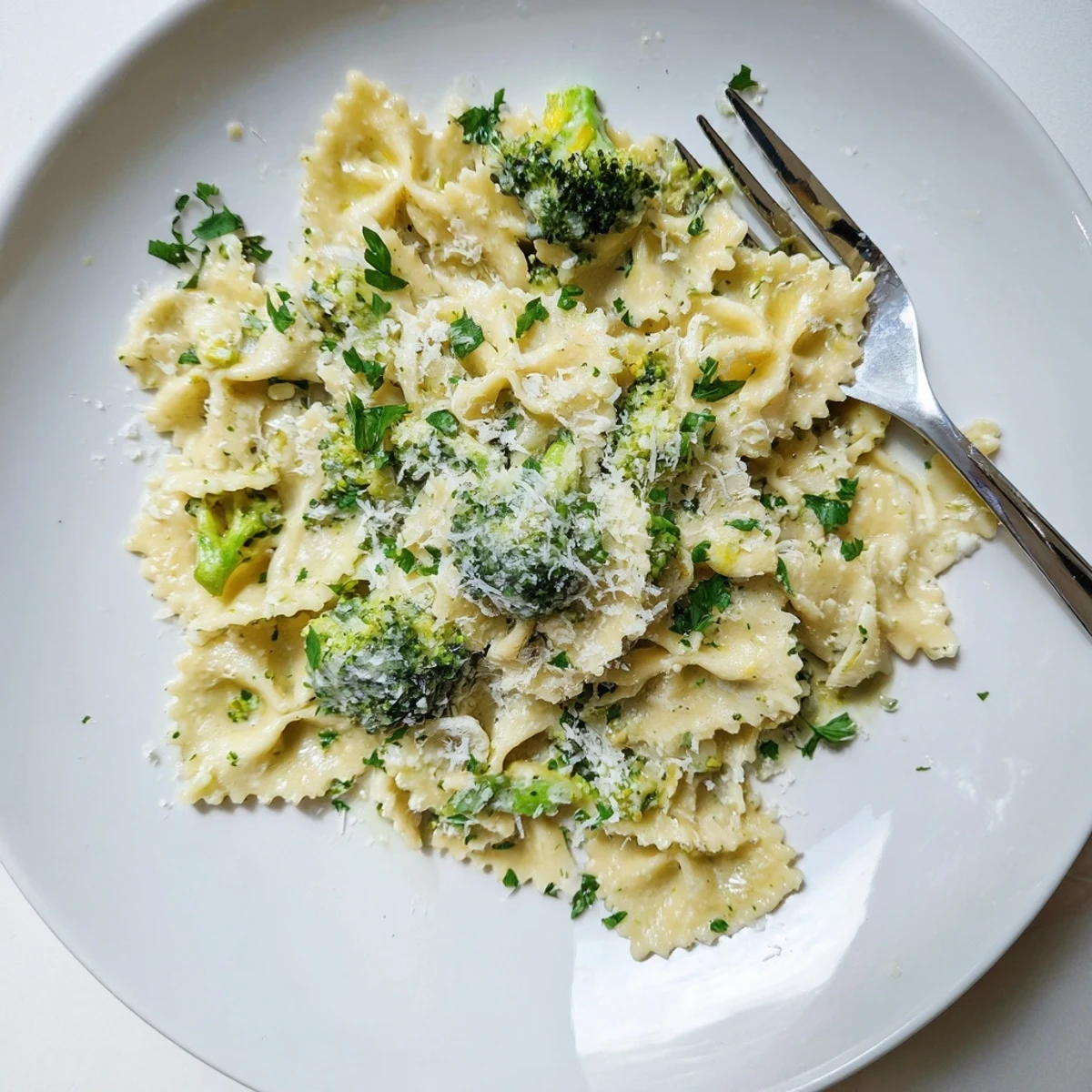 Steaming bowl of Mafaldine Pasta Limone Broccoli coated in a silky garlic cream sauce