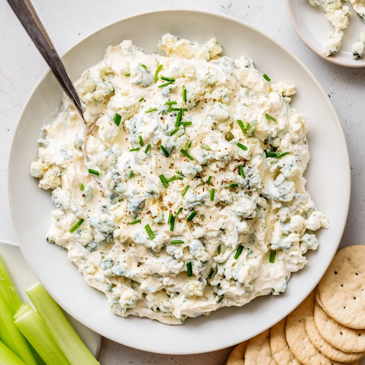 Thick and tangy blue cheese dip topped with crumbles and chopped chives