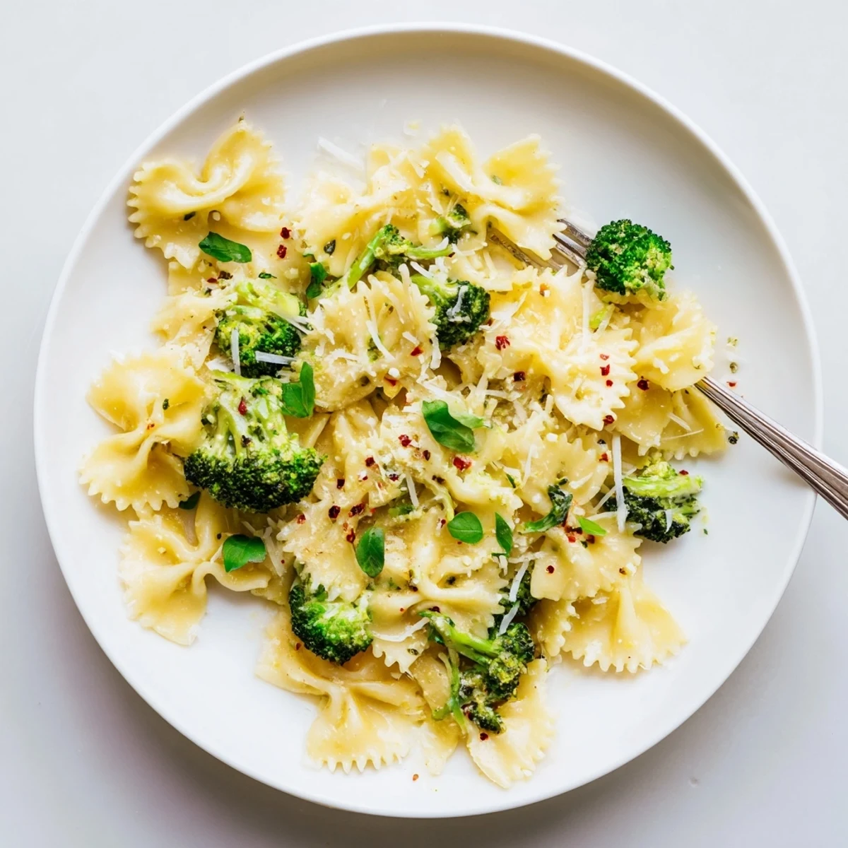 Wavy mafaldine limone broccoli pasta tangled with bright lemon zest melted Parmesan and vibrant broccoli pieces