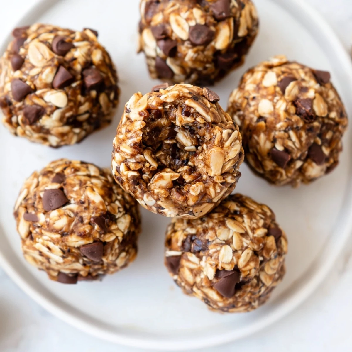 Decadent Snickers energy balls featuring gooey dates, chocolate, and a salty finish