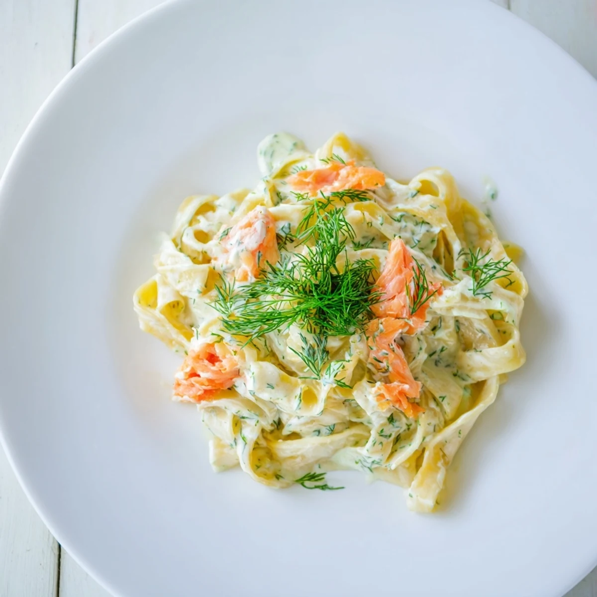 Golden fettuccine tossed in a rich sauce with flaked hot smoked salmon.  