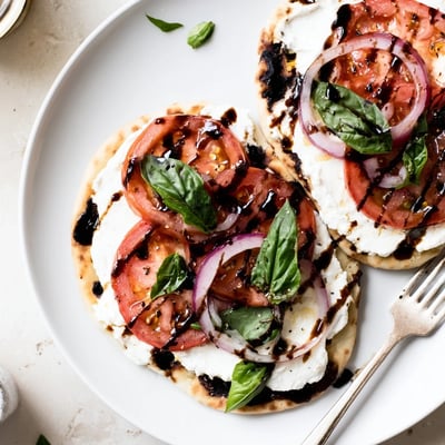 Caprese Pita Pizza With Whipped Garlic Feta on warm oven-crisped pita