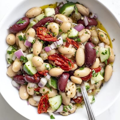 Chilled Dense Bean Salad With Sun Dried Tomatoes, tangy dressing and fresh parsley