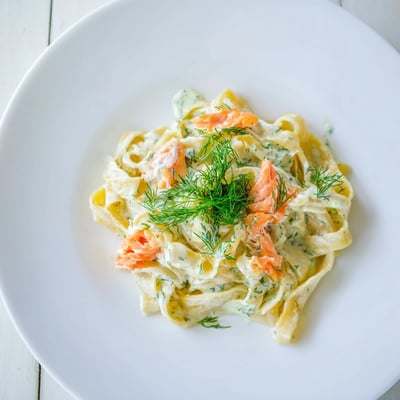 Golden fettuccine tossed in a rich sauce with flaked hot smoked salmon.  